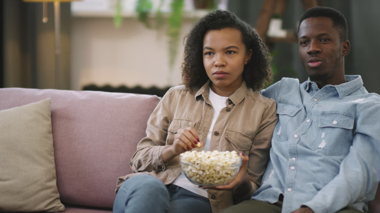 Afro Couple Watching TV Together