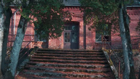 old red brick house, katvari manor in latvia