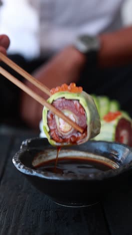 chef preparing a sushi roll