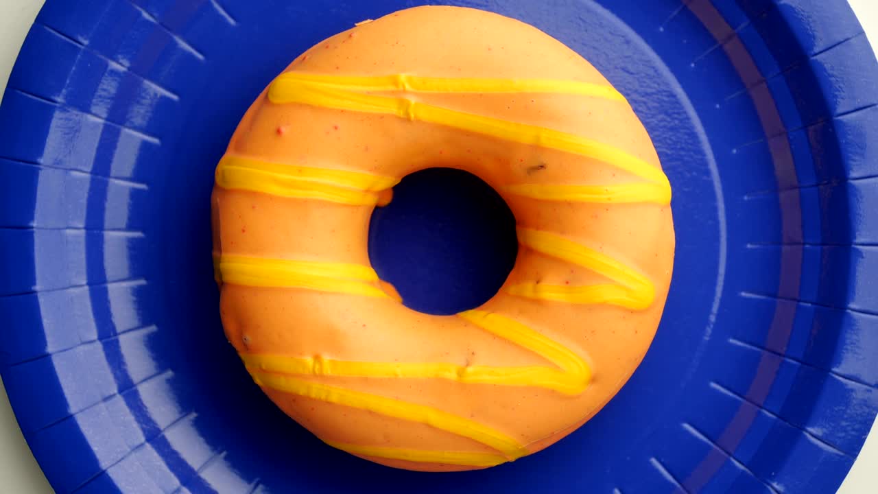 el donut está vidriado de cerca, con un bucle sin costuras.
