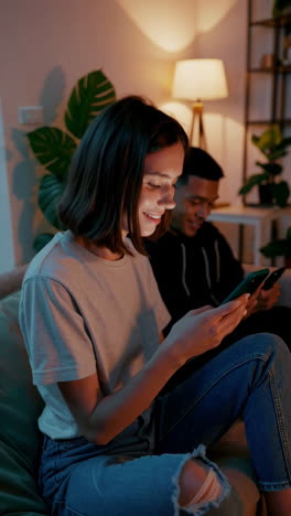 young people engaging with social media on smartphones in a relaxed indoor setting