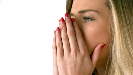 pretty blonde sneezing on white background