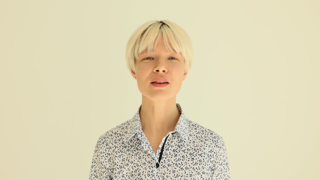 Woman with Short Blonde Hair Showing Different Expressions