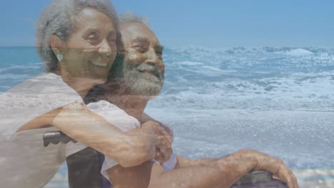 animación de un paisaje marino sobre una mujer biracial y un hombre discapacitado sentado en silla de ruedas