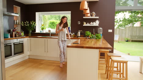 woman enjoying coffee in the morning kitchen