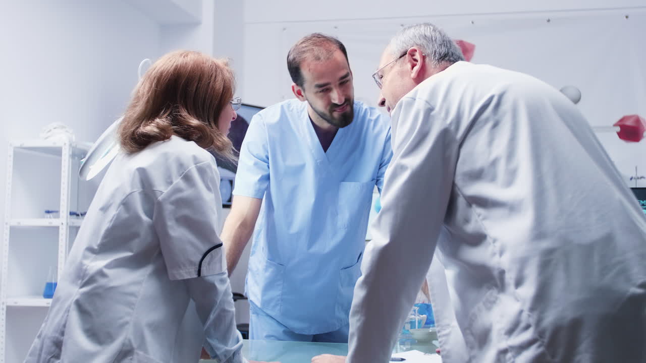 Medical Team Consultation in a Modern Laboratory