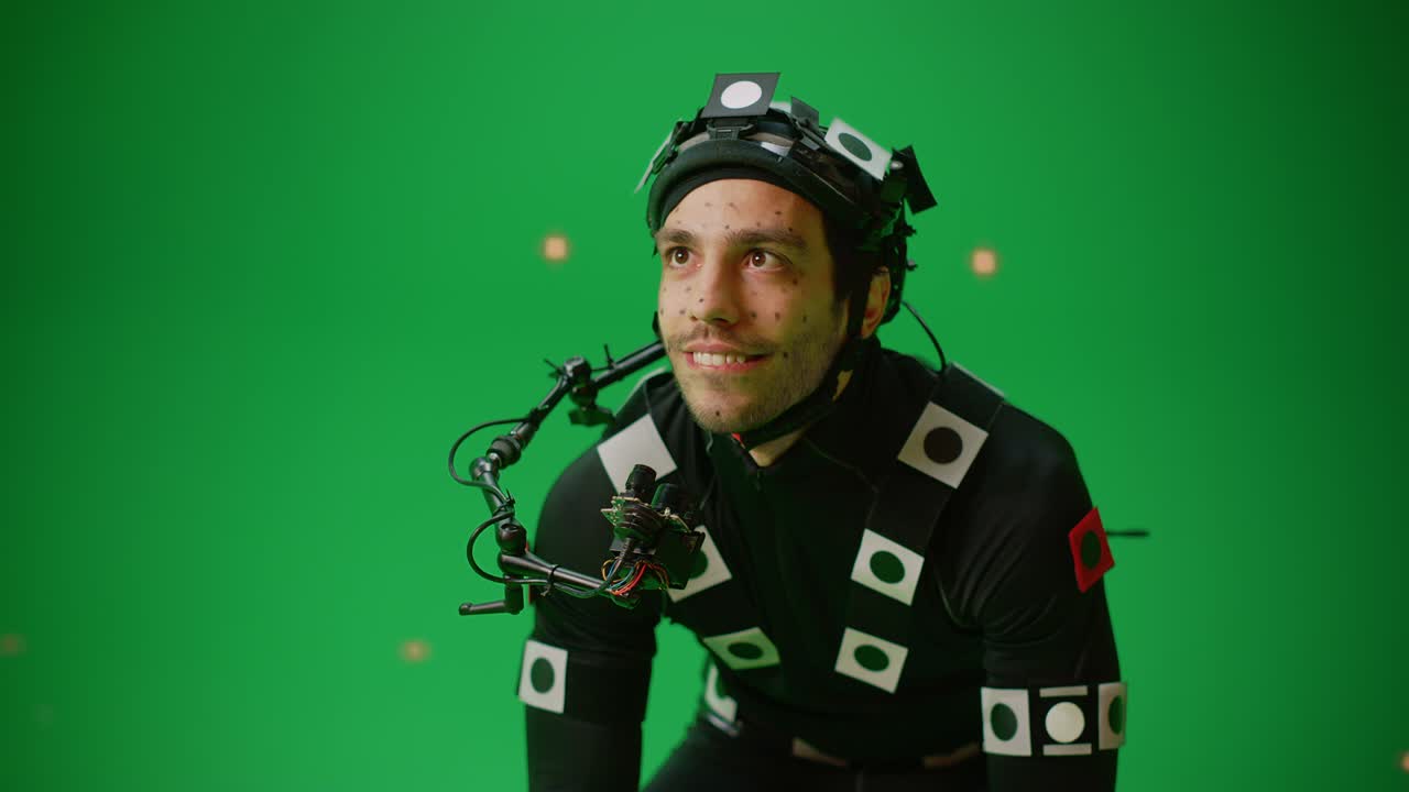 Actor Wearing Motion Caption Suit and Head Rig acts as an Animal or a Monster for CGI Green Screen Scene. Filmmaking On Film Studio Set Shooting Blockbuster Movie with Chroma Key. Closeup Medium Shot