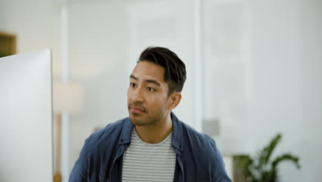 man working on computer in an office