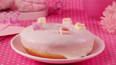 pink glazed donut with marshmallows
