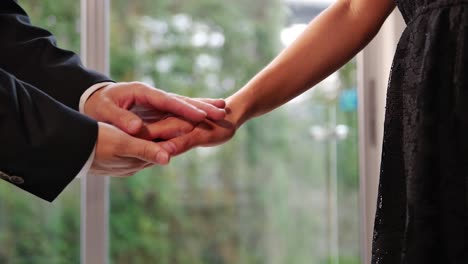 close up businessman hands' comforting woman