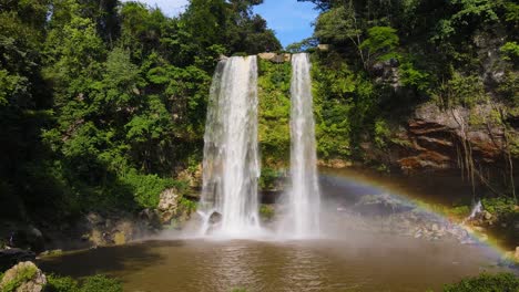 beautiful tropical waterfall in rainforest with rainbow, aerial 4k view - misol-ha waterfalll, chiapas, mexico