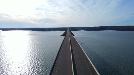 drone flyover of bridge leading into paris landing state park in paris tennessee