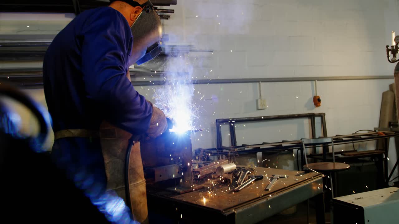 Welder welding a metal
