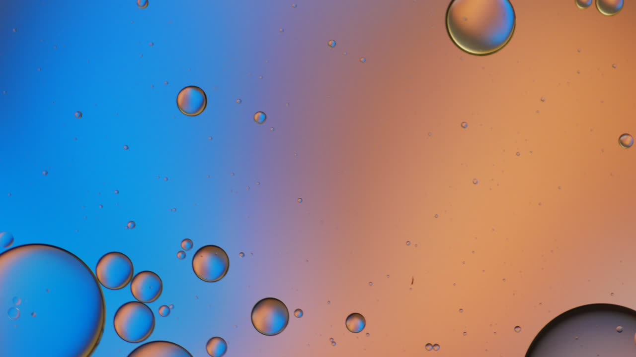 Colorful artistic of oil drop floating on the water.