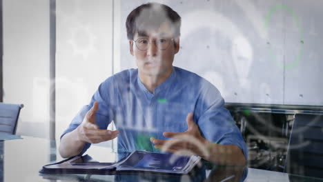 animation of digital icons over businessman on video call