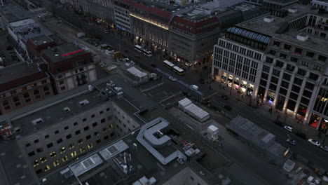 Forwards-fly-above-town-development.-Revealing-Unter-den-Linden-boulevard.-Shipping-street-at-dusk.-Berlin,-Germany