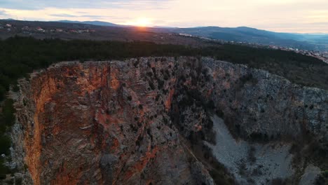 Aerial-view-of-the-Red-Lake-containing-a-karst-lake-close-to-Imotski,-Croatia