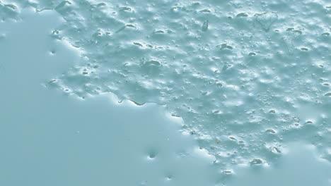 ice melting into water, indicating climate change