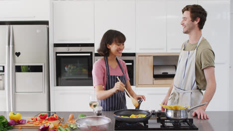 video of happy diverse couple preparing breakfast together