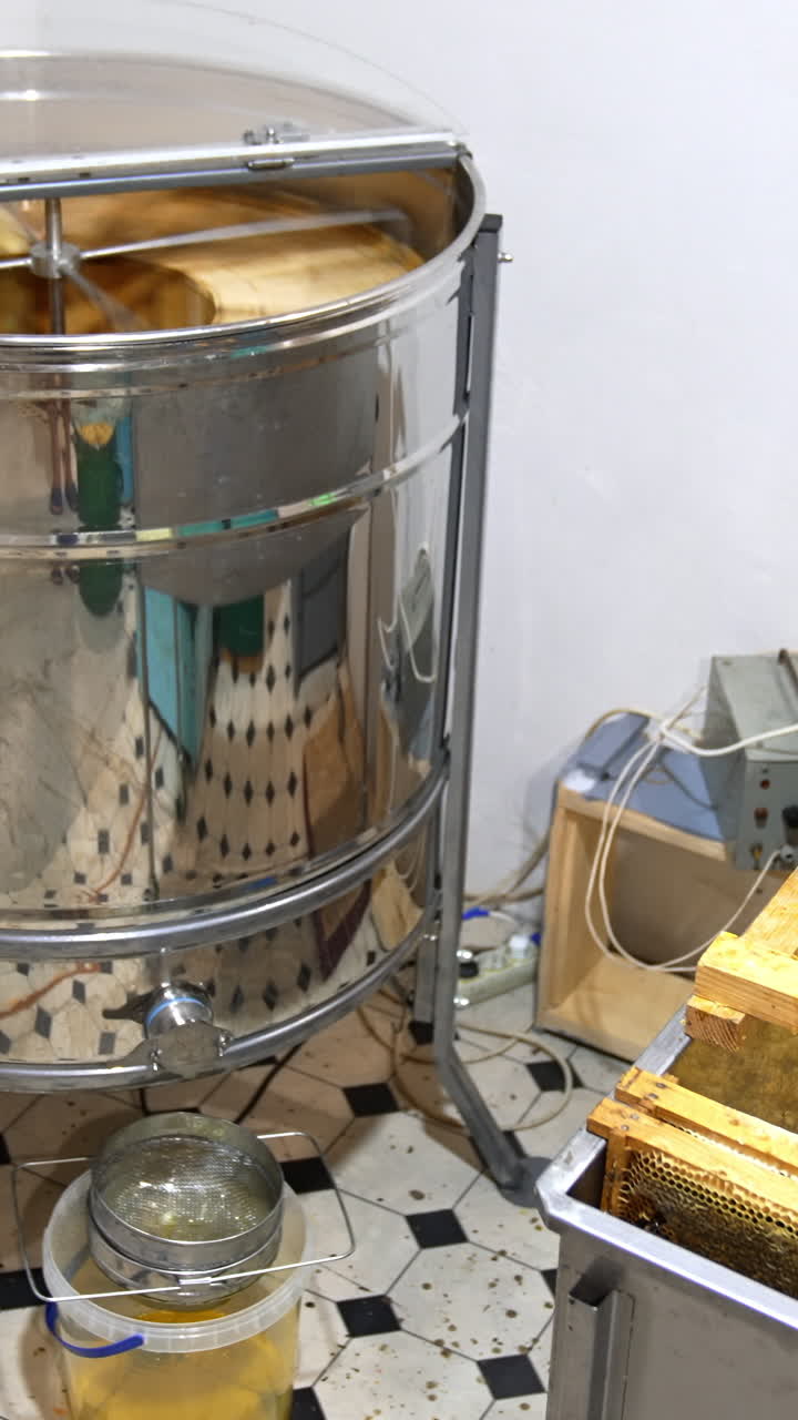 Organic wooden beehive machine. Centifuge honey harvesting. Vertical video
