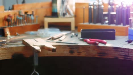 Craftswoman-working-in-workshop