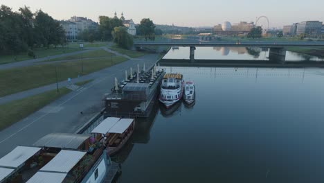 aerial drone shot of kazimierz neighborhood of krakow poland with the river vistula at sunrise