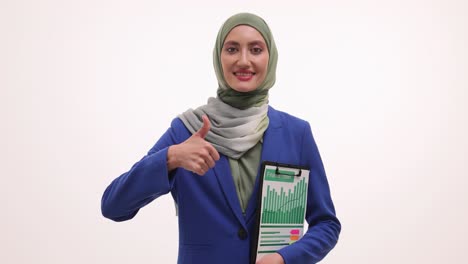 woman in hijab with financial report giving thumbs-up