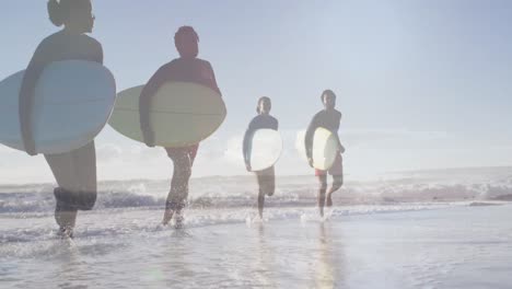 animación de una pareja afroamericana sobre una pareja afroamericana con tablas de surf en la playa