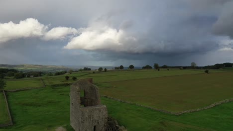 descending footage of magpie mine under a rainy sky