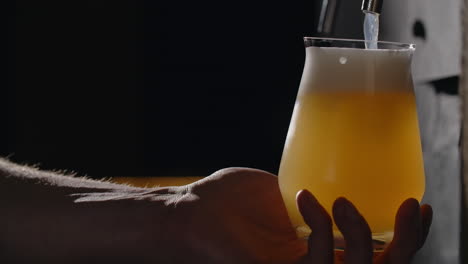 pouring a light beer
