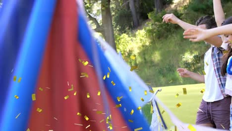 animation of confetti falling over people dancing at summer camp