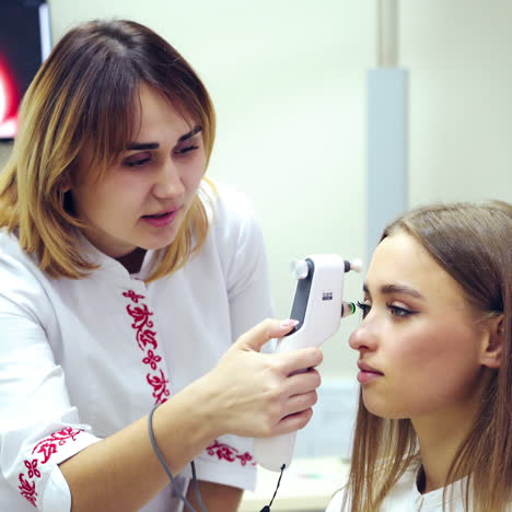 ophthalmologist with modern device. doctor checking patient's eyes using special new equipment. vision concept.