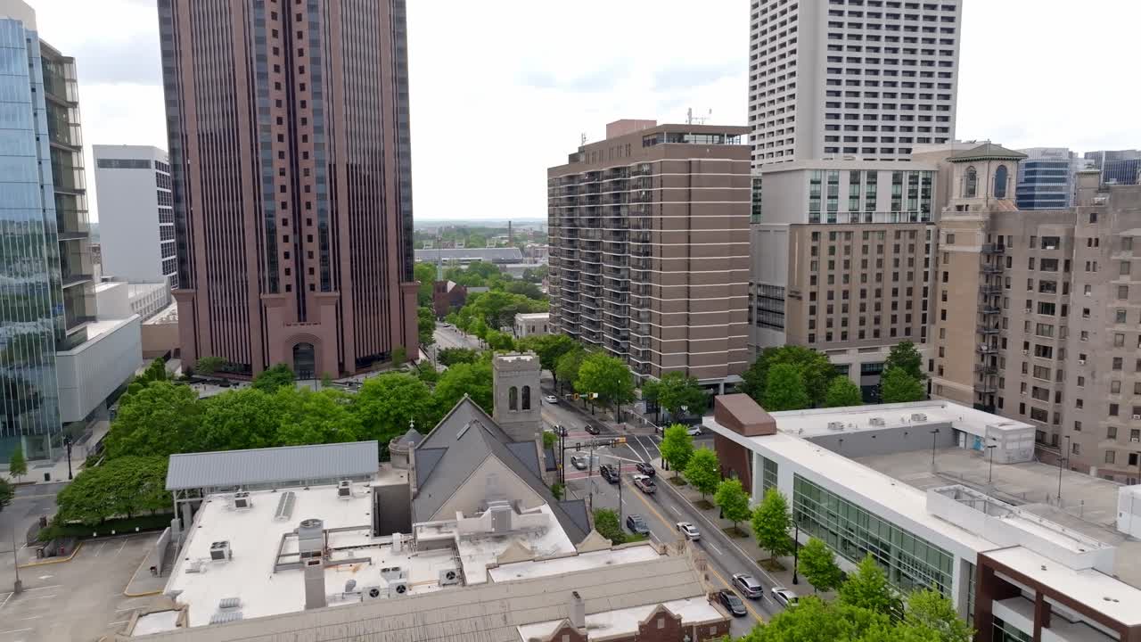 Bank of America financial center at North Avenue street, Green tree lined suburban city streets, Atlanta, Georgia, Drone