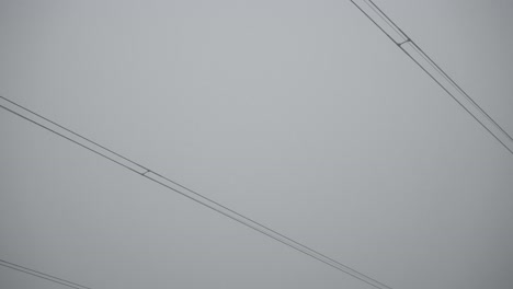 different camera angles showing electric poles in a dramatic, cloudy day