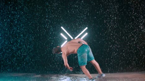 incredible tricking performance, spinning flip kick in rain, slow motion