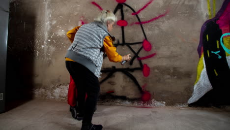 rebel grandma graffiti artist against an urban wall