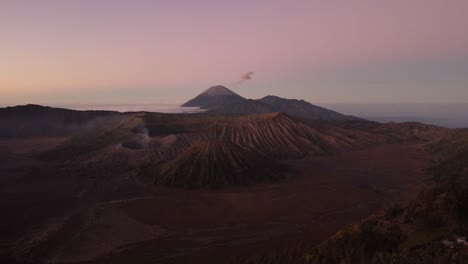 Aerial-sunset-establisher-famous-volcano-group-Bromo-in-Indonesia,-scenic-nature