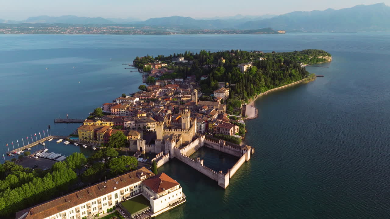 Aerial View Of Sirmione Resort Town At Sunrise On Lake Garda In Northern Italy.