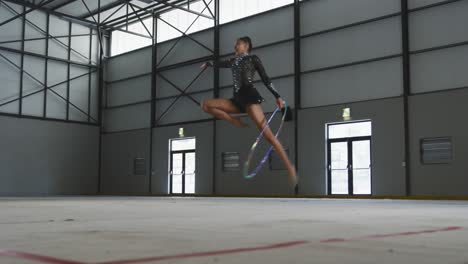 female gymnast performing at sports hall