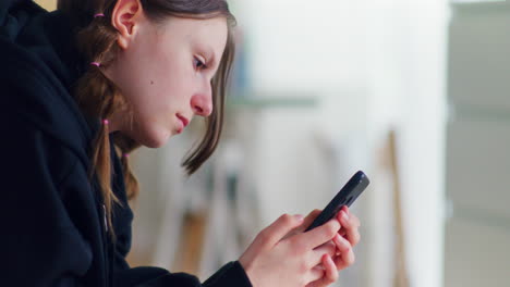 Pensive-Sad-Teenager-Addicted-to-Smartphone-and-Social-Media