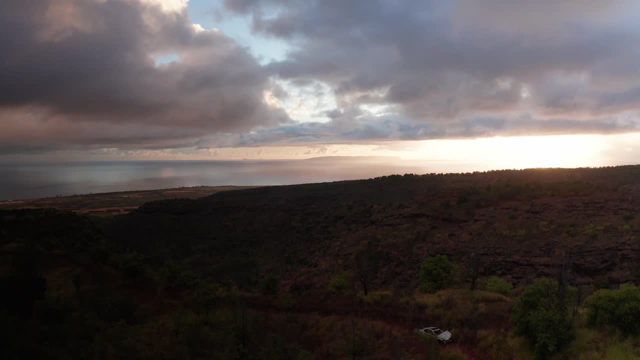 Low rising aerial shot of the Hawaiian island of Ni'ihau off the coast of Kaua'i at sunset