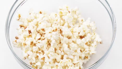 popcorn falling in a bowl