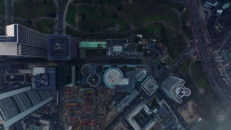 Aerial-birds-eye-overhead-top-down-panning-view-of-downtown-skyscrapers-in-business-hub.-Shot-through-sparse-clouds.-Frankfurt-am-Main,-Germany