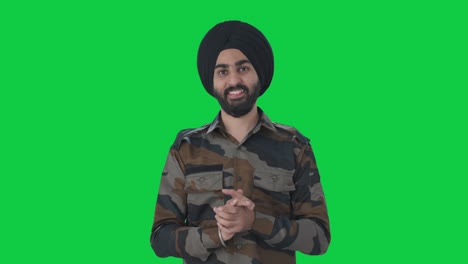 happy sikh indian army man doing namaste green screen