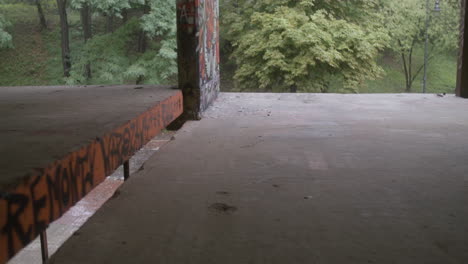 caucasian boys skateboarding in a ruined building.