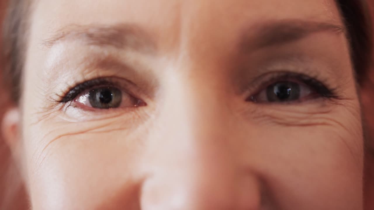 Close up of caucasian mid adult woman's with beautiful eyes in yoga studio