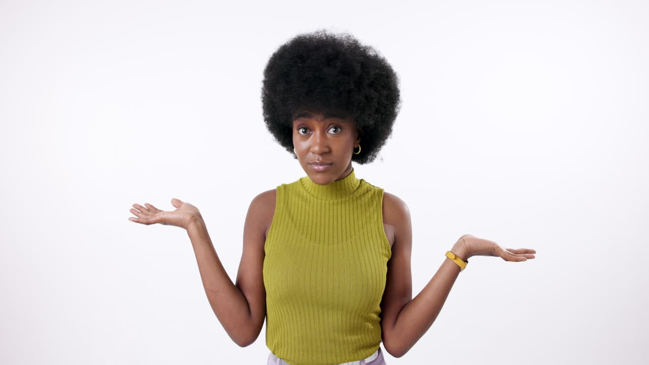 Woman shrugging with unsure expression