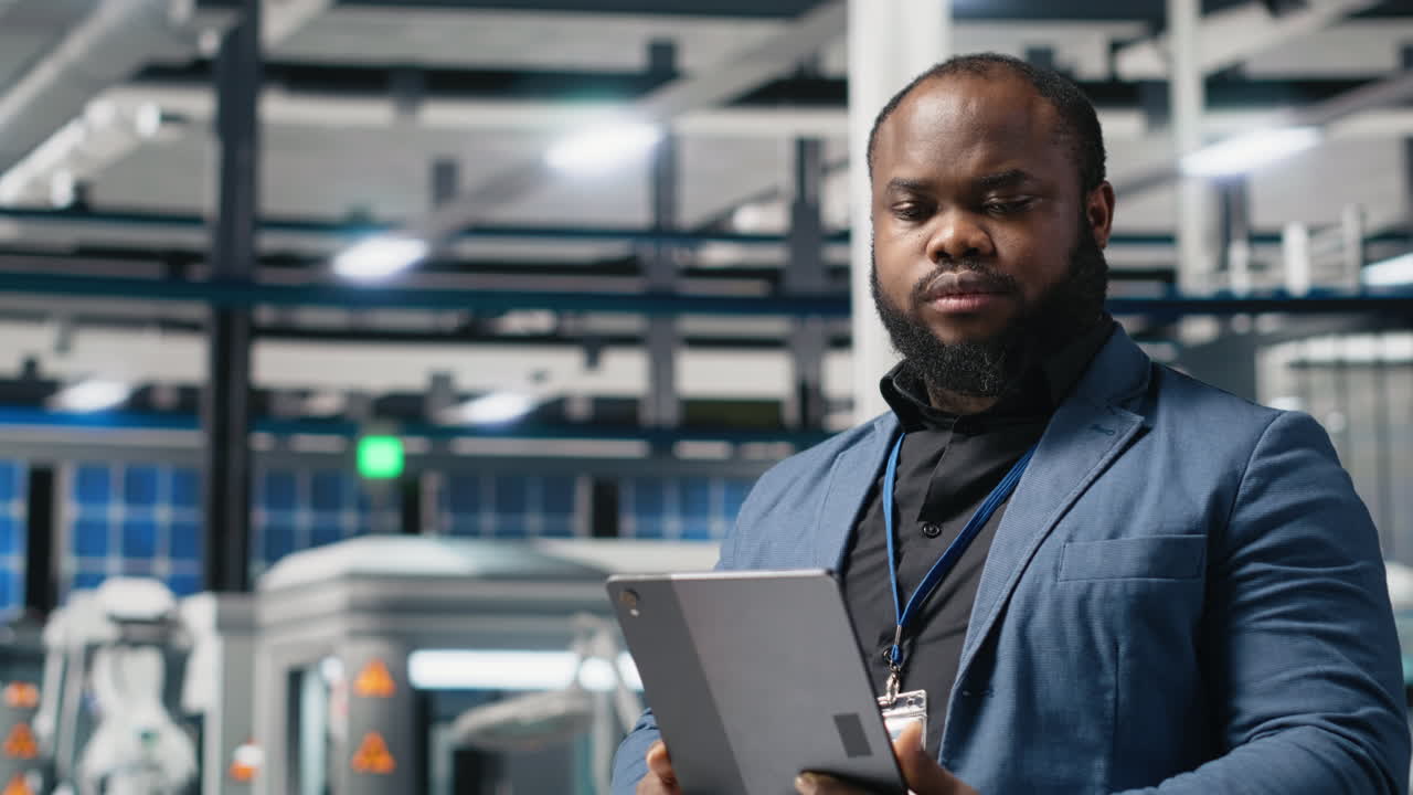 Man using tablet in factory