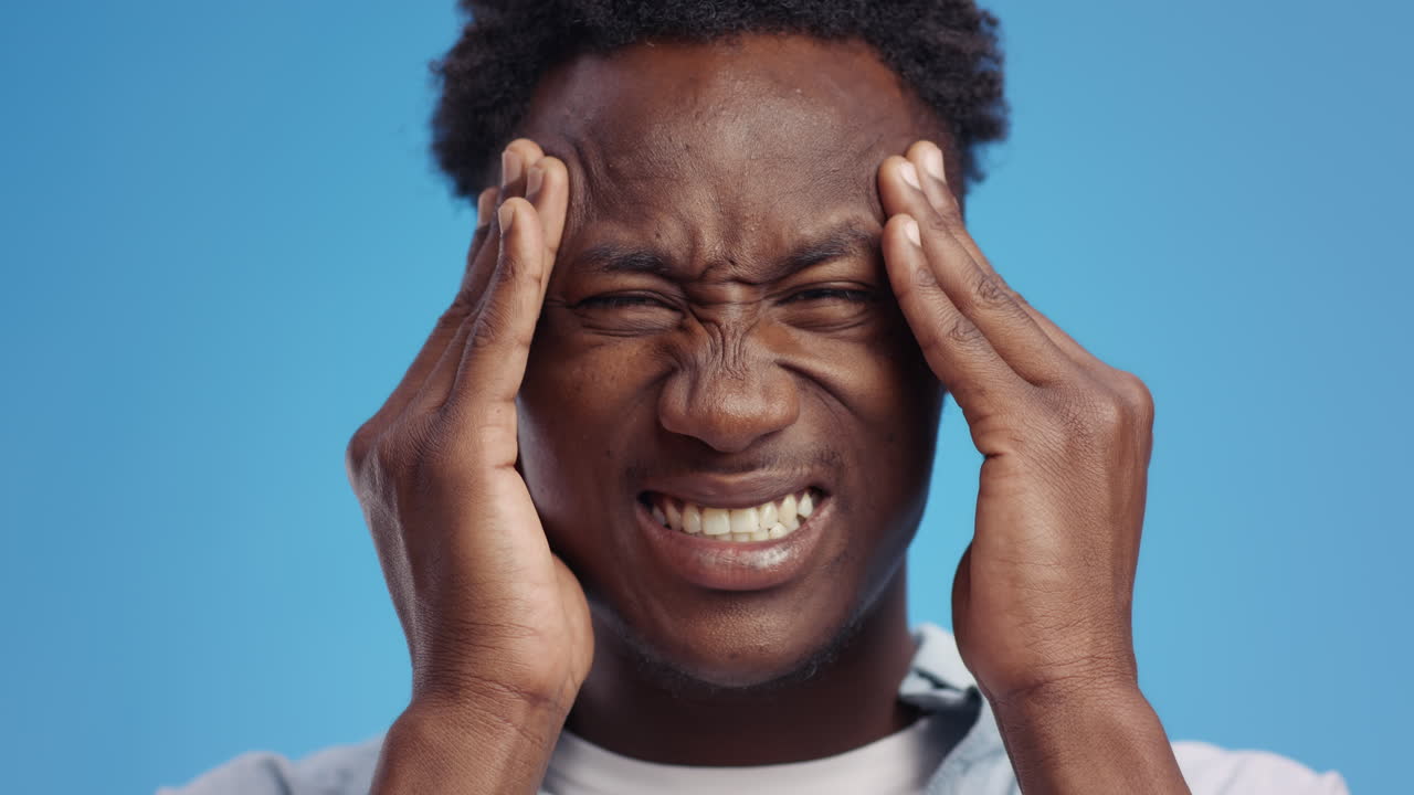 Man Experiencing Headache