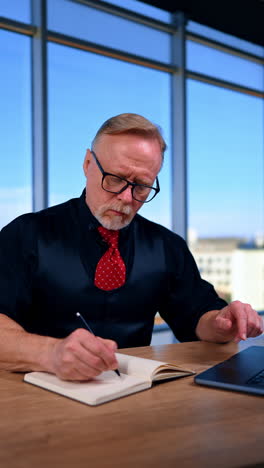 stylish handsome man at office working. confident mature business person. vertical video.